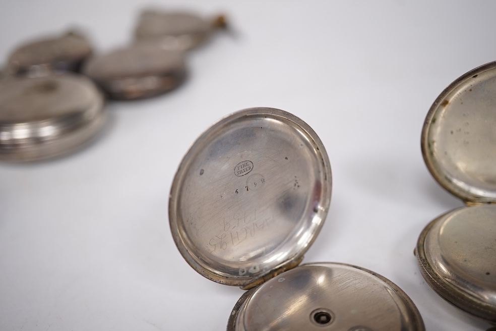 Three early to mid 20th century silver open faced pocket watches, with Roman or Arabic dials and subsidiary seconds, including two keyless and one key wind (Admiral Tacy Watch Co), together with one smaller silver open f